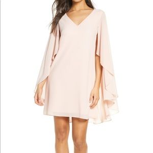 Vince Camuto Sheer Cape Dress tag says size 16. Dress runs small it’s a true 12.